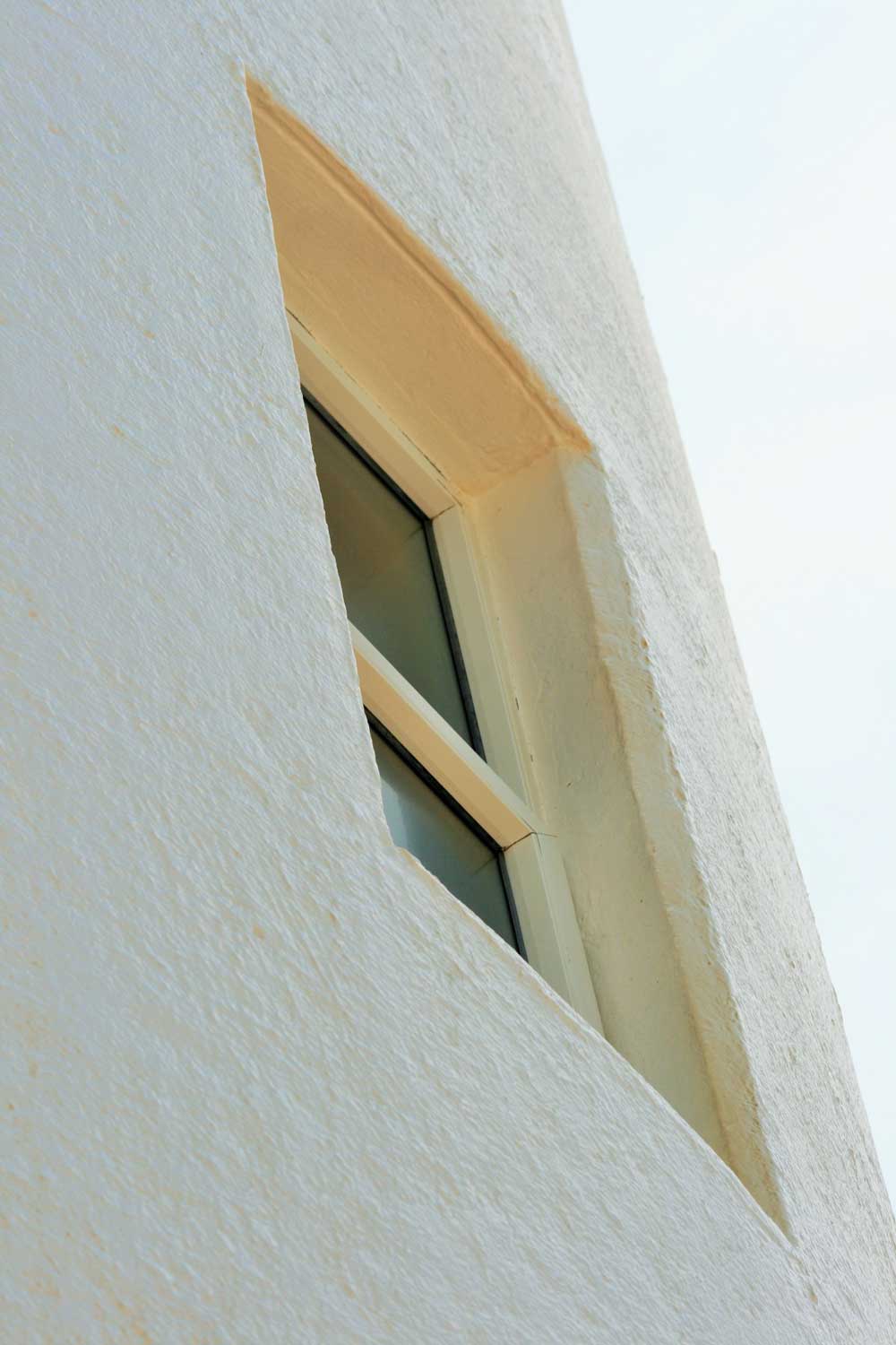 ' . __( 'Close-up, angled view of a window on a white building.' ) . '